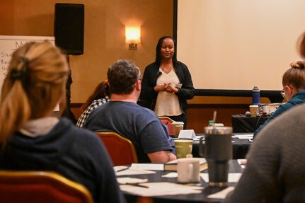 U.S. Air Force Chaplain, Meoshia Wilson brings the weekend to a close during a group discussion about the benefits of the stress-management courses explored during the Joint Base Anacostia-Bolling wellness retreat weekend in Herndon, Virginia on May 3, 2024. Wilson encouraged the participants to find ways to "keep their cup full" by prioritizing self-care and ensuring that service members have the emotional and mental reserves needed to avoid burnout and effectively navigate life's challenges.