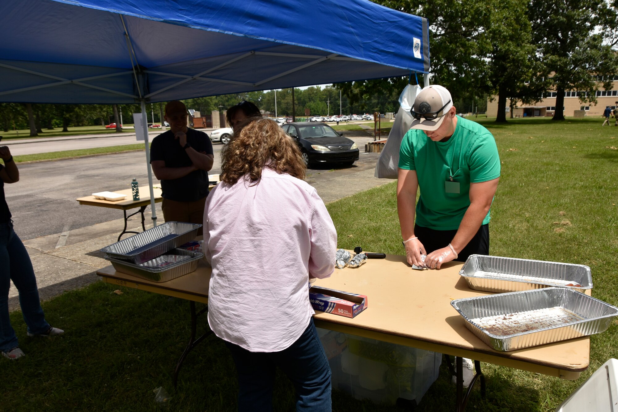 1st Lt. Garrett Thompson with the Arnold Air Force Base Company Grade Officers’ Council, right, prepares food to go out to attendees of the 2024 CGOC Auto Show & Burger Burn at Arnold AFB, Tenn., May 31, 2024. The event, hosted by the Arnold AFB CGOC, was held to raise money for the Arnold AFB Air Force Ball to be held later this year. (U.S. Air Force photo by Bradley Hicks) (This image was altered by obscuring badges for security purposes)

Disclaimer: The CGOC is a private organization which is not part of the Department of Defense or any of its components and has no governmental status.