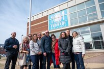 Furnari family descendants pose for a group photo in front of the U.S. Navy Furnari dining hall on Joint Base Anacostia-Bolling, Washington, D.C.