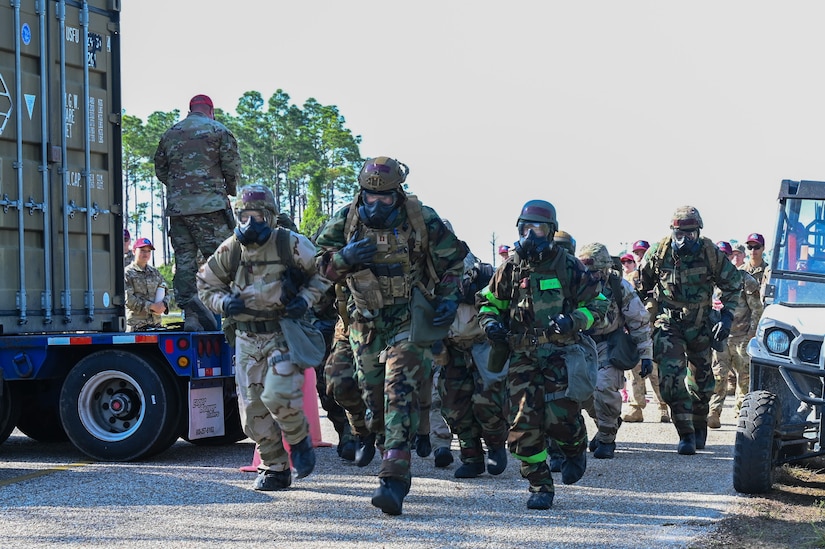 The Air Force District of Washington Team sprint toward the field, scanning for wounded comrades in need of assistance during a simulated deployment scenario on day five of the Readiness Challenge X at Tyndall Air Force Base in Panama City Beach, Florida, on April 26, 2024. This challenge involved teams of civil engineers from all over the world competing in a multi-day series of simulated deployment exercises aimed at evaluating unit readiness, fostering teamwork, and refining combat operation skills. (U.S. Air Force photo by Airman Shanel Toussaint)