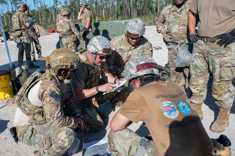 Captain Scott Hattok, 11th Civil Engineer Squadron Operations Flight commander, leads the strategic planning exercise for the Air Force District of Washington Team during Readiness Challenge X at Tyndall Air Force Base, Panama City Beach, Florida on April 24, 2024. The Readiness Challenge is designed to assess combat readiness for military civil engineer units and strengthen their ability to succeed in assigned missions during deployments. (U.S. Air Force photo by Airman Shanel Toussaint)