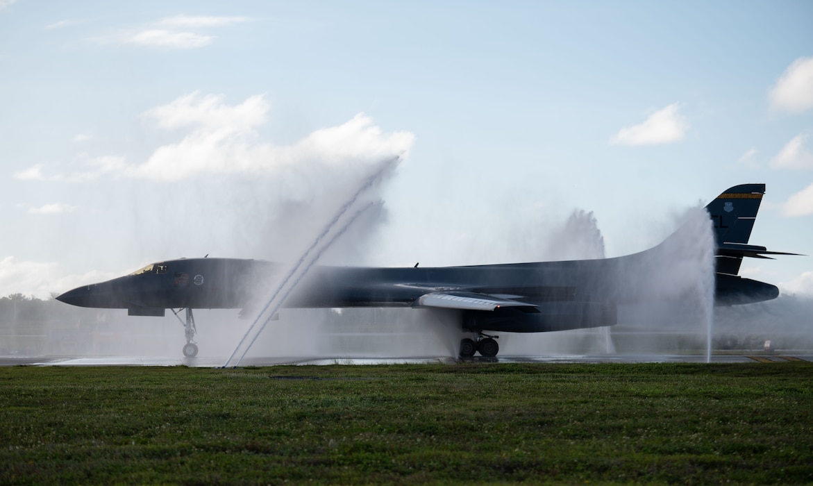 A U.S. Air Force B-1B Lancer from the 37th Expeditionary Bomb Squadron receives a bath upon landing