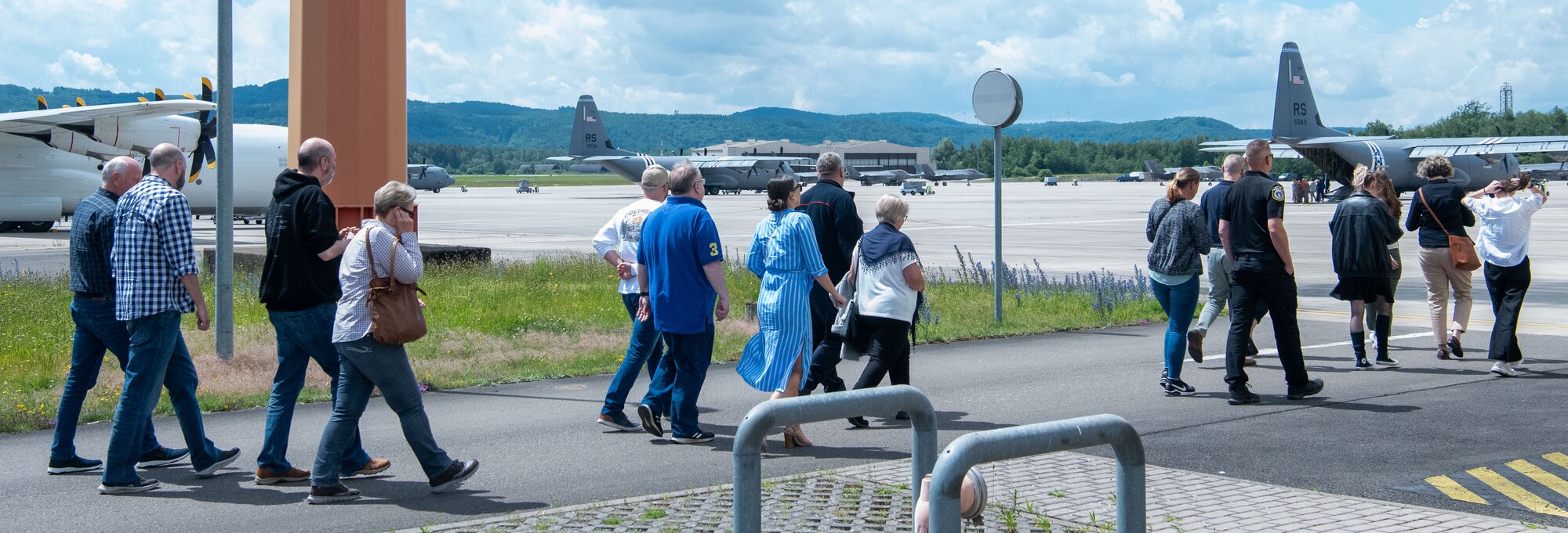 people walk outside to look at aircraft