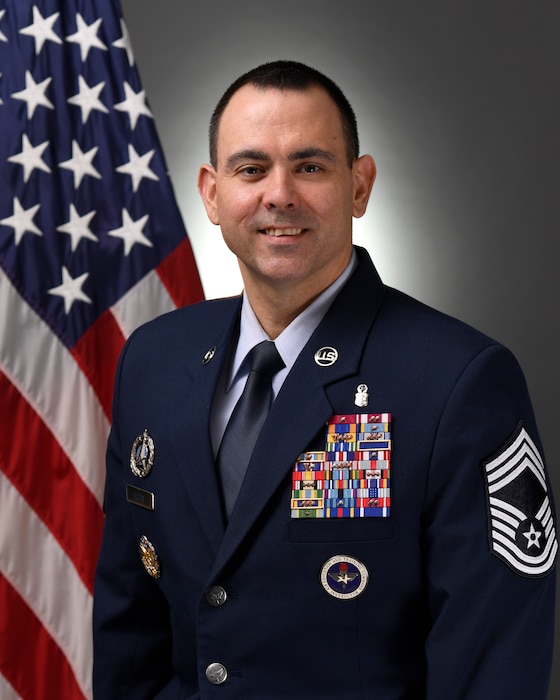 This is the official portrait of Chief Master Sergeant James M. Woods.