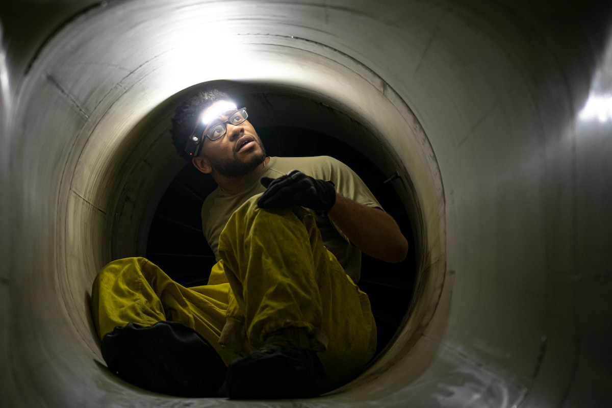 F-15E Strike Eagle maintainer, assigned within the U.S. Central Command area of responsibility, inspects the intake.