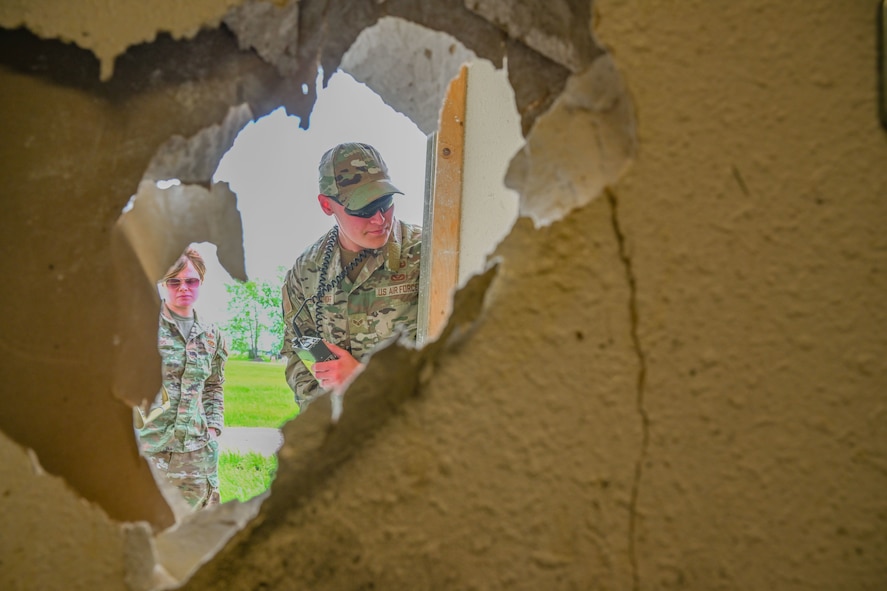 U.S. Air Force Senior Airman Nikita Dospehoff, 5th Civil Engineer Squadron Explosive Ordnance Disposal (EOD) technician, assesses a simulated threat using a radiation detector during Hydra Fury 24 at Minot Air Force Base, North Dakota, June 5, 2024. Hydra Fury 24 consisted of three scenarios that tested different aspects of the EOD mission.