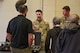 U.S. Air Force Staff Sergeants Ian Howard and Mason Falck, Team Minot Airmen assigned to the 5th Civil Engineer Squadron Explosive Ordnance Disposal (EOD) flight, talk about EOD equipment during a technical exchange at Minot Air Force Base, North Dakota, June 4, 2024. The technical exchange was part of Hydra Fury 24, an exercise consisting of multiple agencies across the Departments of Defense, Energy and Justice.