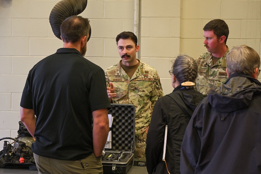 U.S. Air Force Staff Sergeants Ian Howard and Mason Falck, Team Minot Airmen assigned to the 5th Civil Engineer Squadron Explosive Ordnance Disposal (EOD) flight, talk about EOD equipment during a technical exchange at Minot Air Force Base, North Dakota, June 4, 2024. The technical exchange was part of Hydra Fury 24, an exercise consisting of multiple agencies across the Departments of Defense, Energy and Justice.