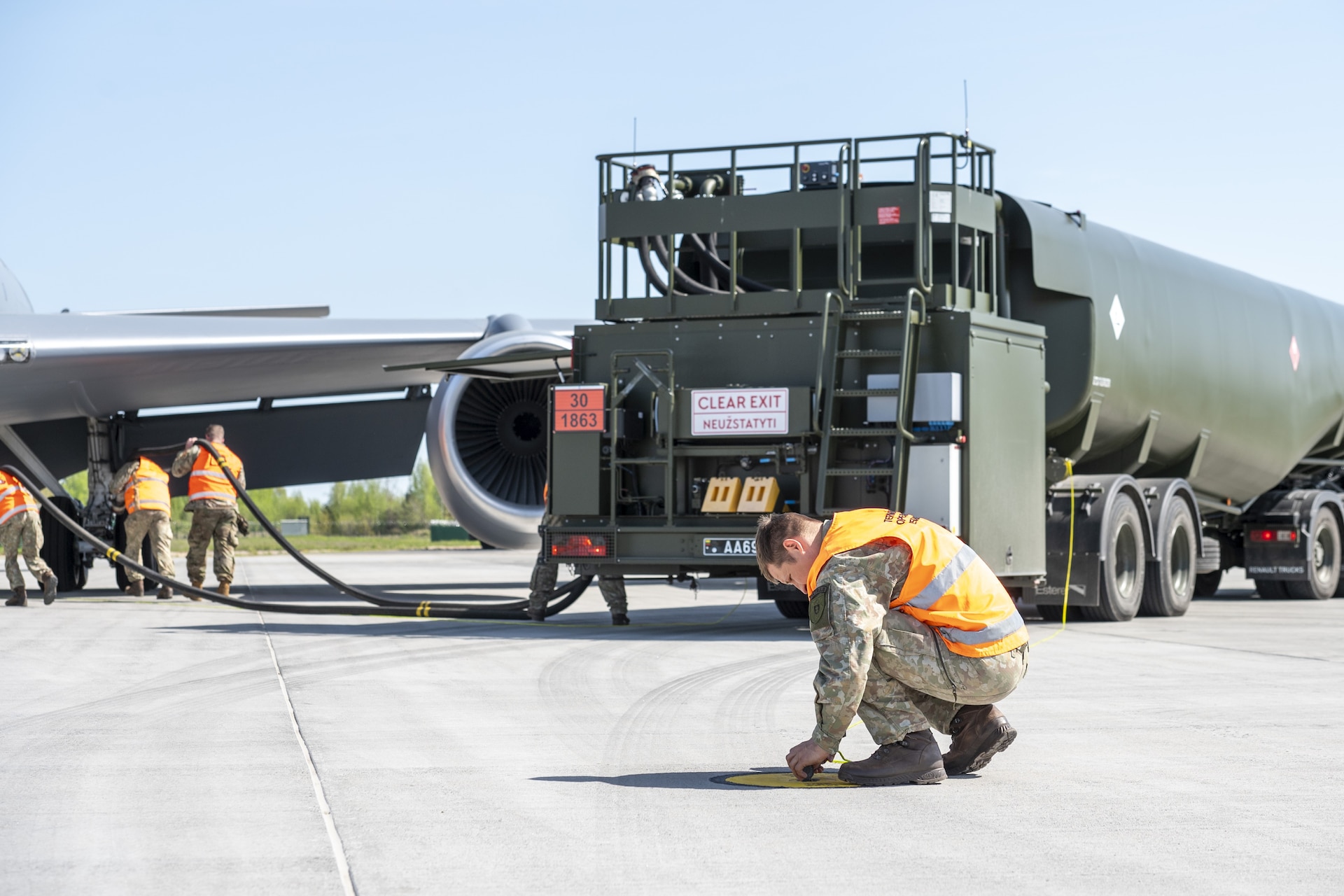 Two members from the 171st Air Refueling Wing, Pennsylvania Air National Guard, share best practices about hot pit refueling on a KC-135 Stratotanker aircraft with the Lithuanian Air Force during the most recent State Partnership Program engagement May 2, 2024, in Siauliai, Lithuania. Pennsylvania and Lithuania have been partner states for over 30 years. (U.S. Air National Guard photo by Tech. Sgt. Zoe M. Wockenfuss)