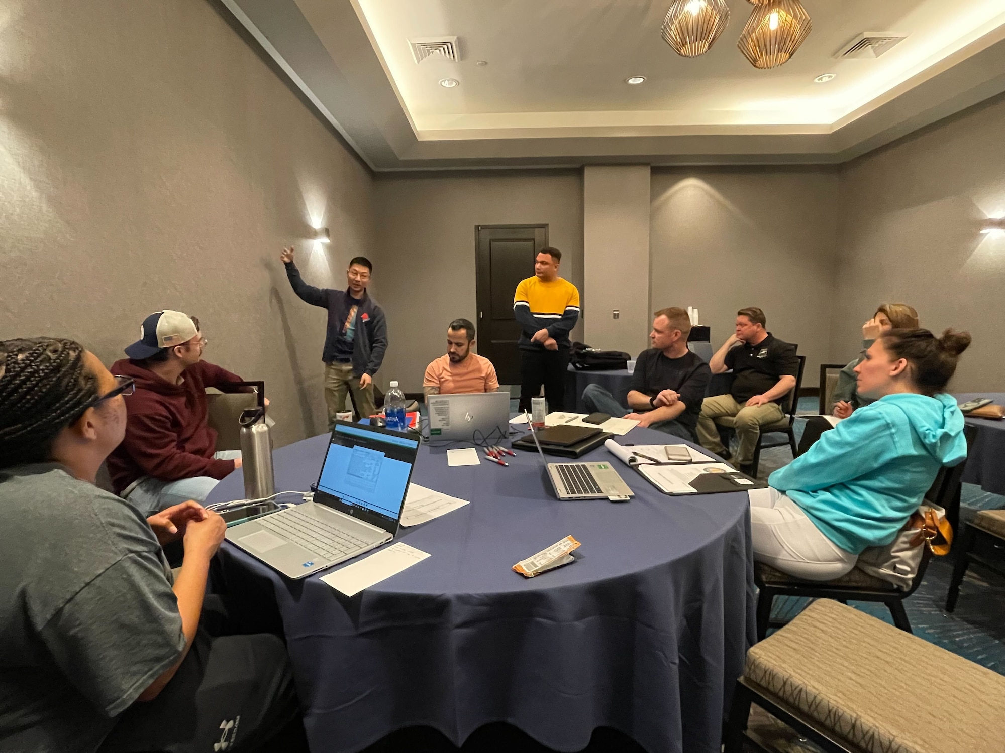 ATAC-16 team members work through a problem while staying at a hotel in Washington D.C. (Courtesy Photo)