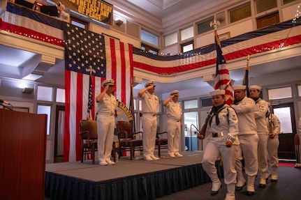 Rear Admiral Max McCoy, commander, Carrier Strike Group Four (CSG-4), left, Capt. Sean Anderson, middle, and Capt. James Quaresimo, salute the colors as they parade at Tactical Training Group Atlantic (TTGL)'s change of command ceremony.