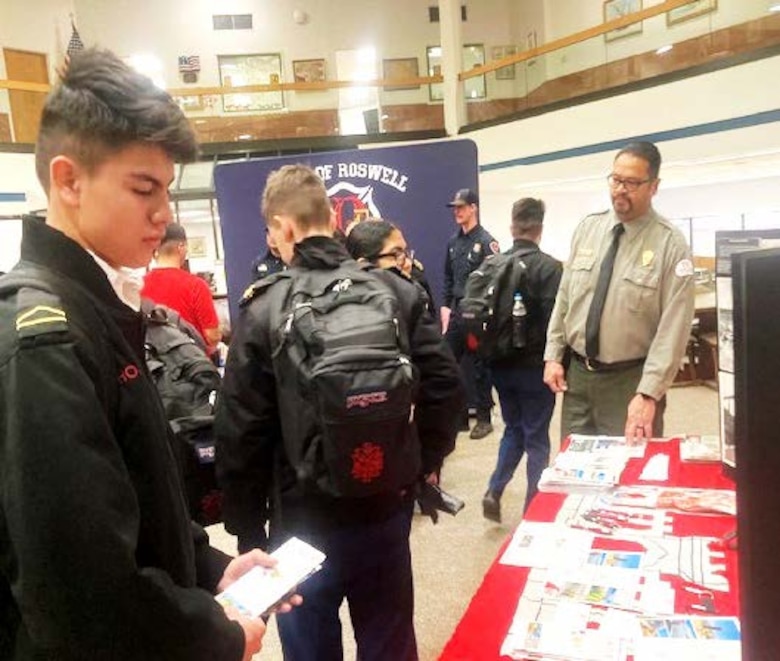 Paul Sanchez, right, park ranger at Santa Rosa Lake, N.M., talks to cadets about USACE and the Albuquerque District at the New Mexico Military Institute during National Engineering Week 2024.