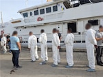 The crew of the Coast Guard Cutter Charles David Jr. offloaded and transferred custody of 245 kilograms of cocaine and nine suspected smugglers to Drug Enforcement Administration authorities at Coast Guard Base San Juan, Puerto Rico, June 7, 2024. The seizure and apprehension resulted from the interdiction of a drug smuggling vessel by the Coast Guard Cutter Heriberto Hernandez in waters southeast of St. Croix, U.S. Virgin Islands, June 3, 2024, and is the result of multi-agency efforts involving Coast Guard’s Western Hemisphere Strategy, the Caribbean Corridor Strike Force Initiative and Operation Unified Resolve. (U.S. Coast Guard photo)