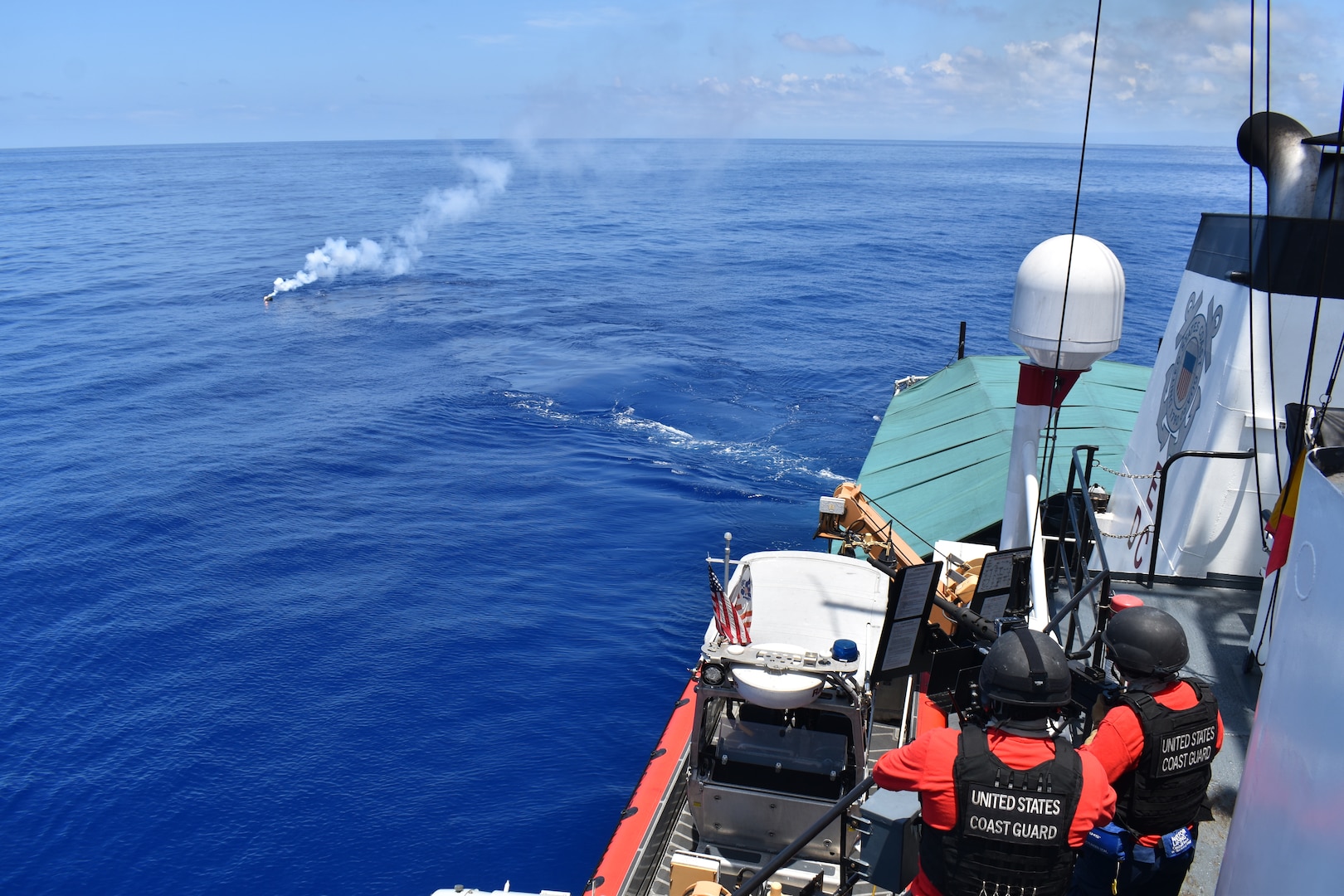 Crewmembers assigned to the Coast Guard Cutter Resolute (WMEC 620) aim at a simulated target with a M2HB .50 caliber machine gun during a live fire gunnery exercise in Caribbean Sea, May 10, 2024. Resolute frequently conducts gunnery exercises to maintain readiness in all areas of naval warfare operations. (U.S. Coast Guard photo courtesy of Resolute)