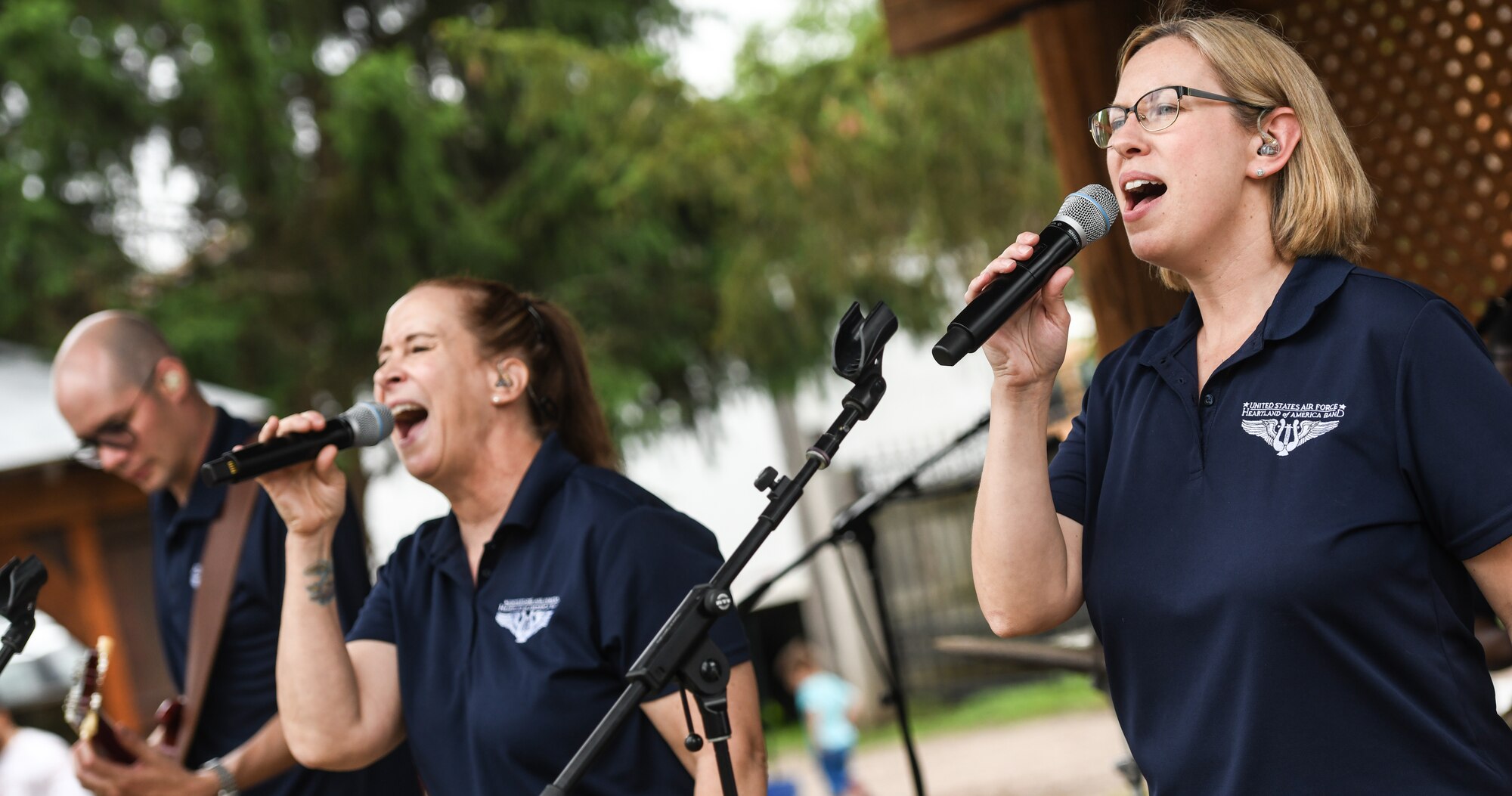 singers sing on stage