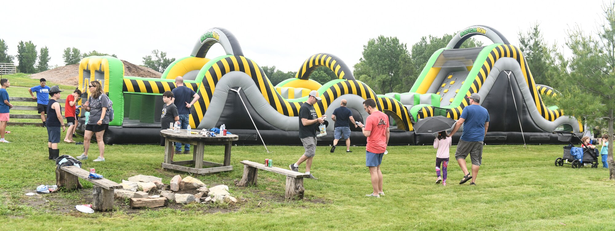 kids and families play at a bouncy house