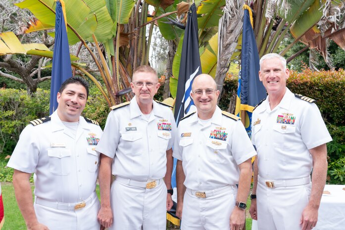 Cmdr. Danny Soria, Engineering Duty Officer (EDO) Schoolhouse executive officer (left); Vice Adm. Johnny Wolfe Jr., director of U.S. Navy Strategic Systems Programs (SSP) (next to left); Rear Adm. Casey Moton, Program Executive Officer, Aircraft Carriers; and Capt. Neil Sexton, Engineering Duty Officer (EDO) Schoolhouse commander (right), pose for a photo during the school's fiftieth anniversary EDO School Thursday, June 6. All four officers are EDOs and graduates of both the basic and senior leader courses provided by the schoolhouse. The EDO school-established in 1974 and founded by Naval Sea Systems Command Commander Vice Adm. Robert C. Gooding-provides education to improve the professional proficiency of EDOs through training in plans, programs, policies, and procedures that drive the life-cycle engineering of naval ships and systems. (U.S. Navy Photo by Lt. Jennifer Bowman/Released)