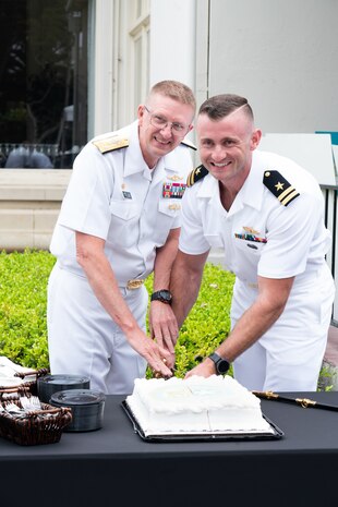 Vice Adm. Johnny Wolfe Jr., director of U.S. Navy Strategic Systems Programs (left) and Lt. David Heckman (right) participate in a cake cutting to honor the fiftieth anniversary of the Engineering Duty Officer (EDO) Schoolhouse. Vice Adm. Wolfe is the senior-most active duty EDO in the community and Lt. Heckman, the most junior. The schoolhouse, established in 1974, celebrated figures in the community and the integral role EDOs play in shaping the world's greatest Warfighting Navy and supporting the warfighter. (U.S. Navy Photo by Lt. Jennifer Bowman/Released)