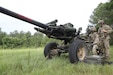 Louisiana National Guard Soldiers assigned to Alpha Battery, 1-141st Field Artillery, 256th Infantry Brigade, Jackson Barracks, Louisiana prepare an M-119 Alpha Three Howitzer for a fire support mission during Exportable Combat Training Capability 24-01 at Camp Shelby, Mississippi.