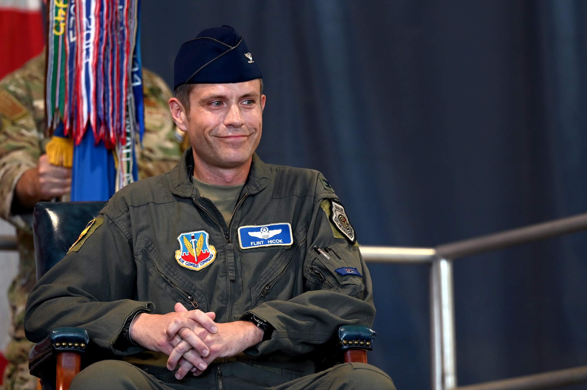 U.S. Air Force Col. Kevin Hicok, incoming 20th Fighter Wing commander, smiles at his wife and children during a 20th FW change of command ceremony at Shaw Air Force Base, S.C., June 7, 2024. Hicok, who arrived at Shaw with his family in July 2021, is an accomplished F-16 Fighting Falcon pilot with over 2,000 flying hours, including 191 combat hours. (U.S. Air Force photo by Staff Sgt. Kelsey Owen)