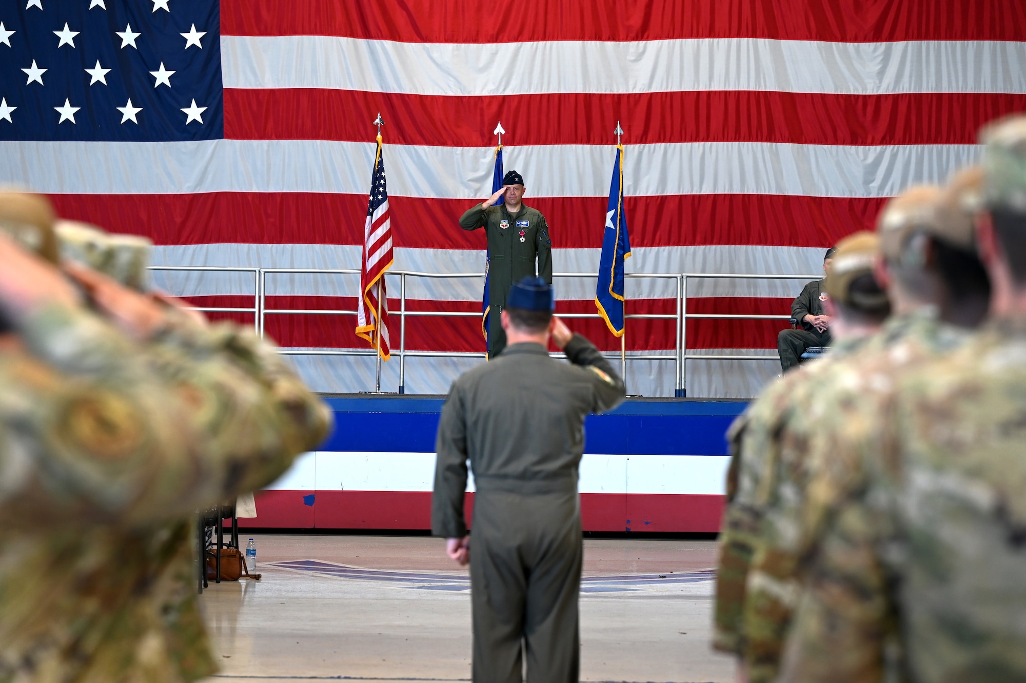 U.S. Air Force Col. Kristoffer Smith, center top, receives a final salute as commander of the 20th Fighter Wing during a change of command ceremony at Shaw Air Force Base, S.C., June 7, 2024. Traditionally, members will receive a first salute upon accepting command of a unit and a final salute before relinquishing command to the next person. (U.S. Air Force photo by Staff Sgt. Kelsey Owen)