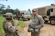 Lt. Col. Cassidy Dauby, Battalion Commander, 2-346th Training Support Battalion, Camp Shelby, Mississippi, talks with Capt. John Lombardo, Bravo Company, 2-156th Infantry Battalion, Louisiana National Guard, New Iberia, Louisiana, as trucks transport Soldiers to a location during XCTC 24-01. Dauby, a State Department Consular Officer in civilian life, travels each month from Bogota, Colombia to Camp Shelby, Mississippi to attend battle assembly weekend. The 2004 West Point graduate has 20 years of combined service in the active Army and U.S. Army Reserve.
(U.S. Army Reserve photo by Staff Sgt. David Lietz)