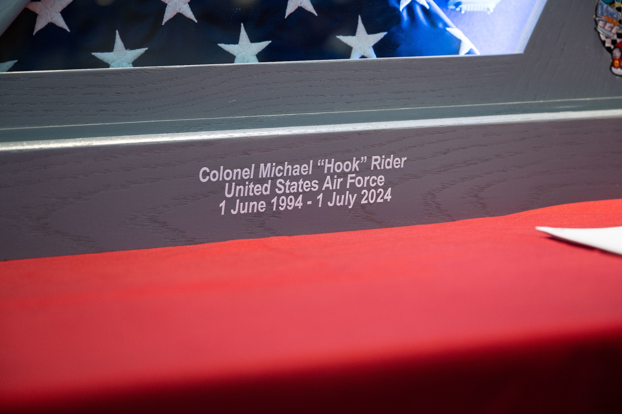 A shadow box sits on a table.