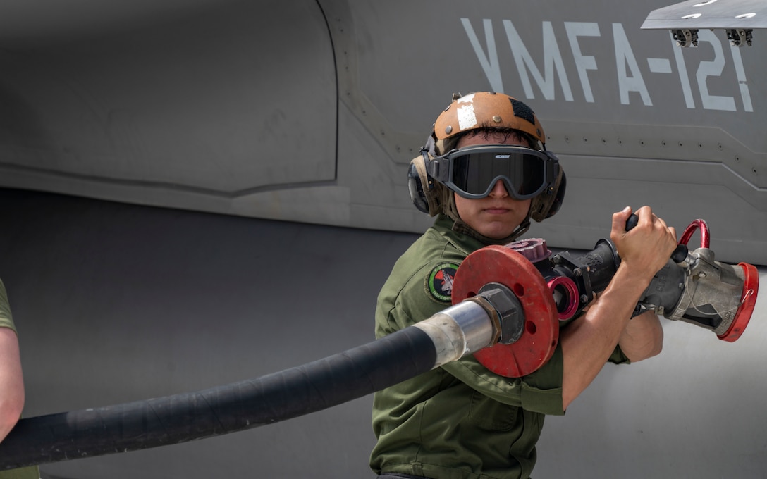 U.S. Marine Corps Cpl. Joshua Blake, a fixed wing aircraft mechanic with Marine Fighter Attack Squadron 121 refuels an F-35B Lightning II, embarked aboard the amphibious assault carrier USS Tripoli (LHA 7), at Andersen Air Force Base, Guam, June 14, 2022, in preparation of a joint maritime strike rehearsal to demonstrate service components fires and effects capabilities in the maritime environment during exercise Valiant Shield 22 (VS 22). Exercises such as Valiant Shield allows the Indo-Pacific Command Joint Task Force the opportunity to integrate forces from all branches of service to conduct long-range, precise, lethal, and overwhelming multi-axis, multi-domain effects that demonstrate the strength and versatility of the Joint Task Force and our commitment to a free and open Indo-Pacific. (U.S. Marine Corps photo by Cpl. Mitchell Austin)