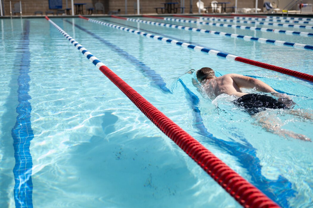 Members swimming in pool.