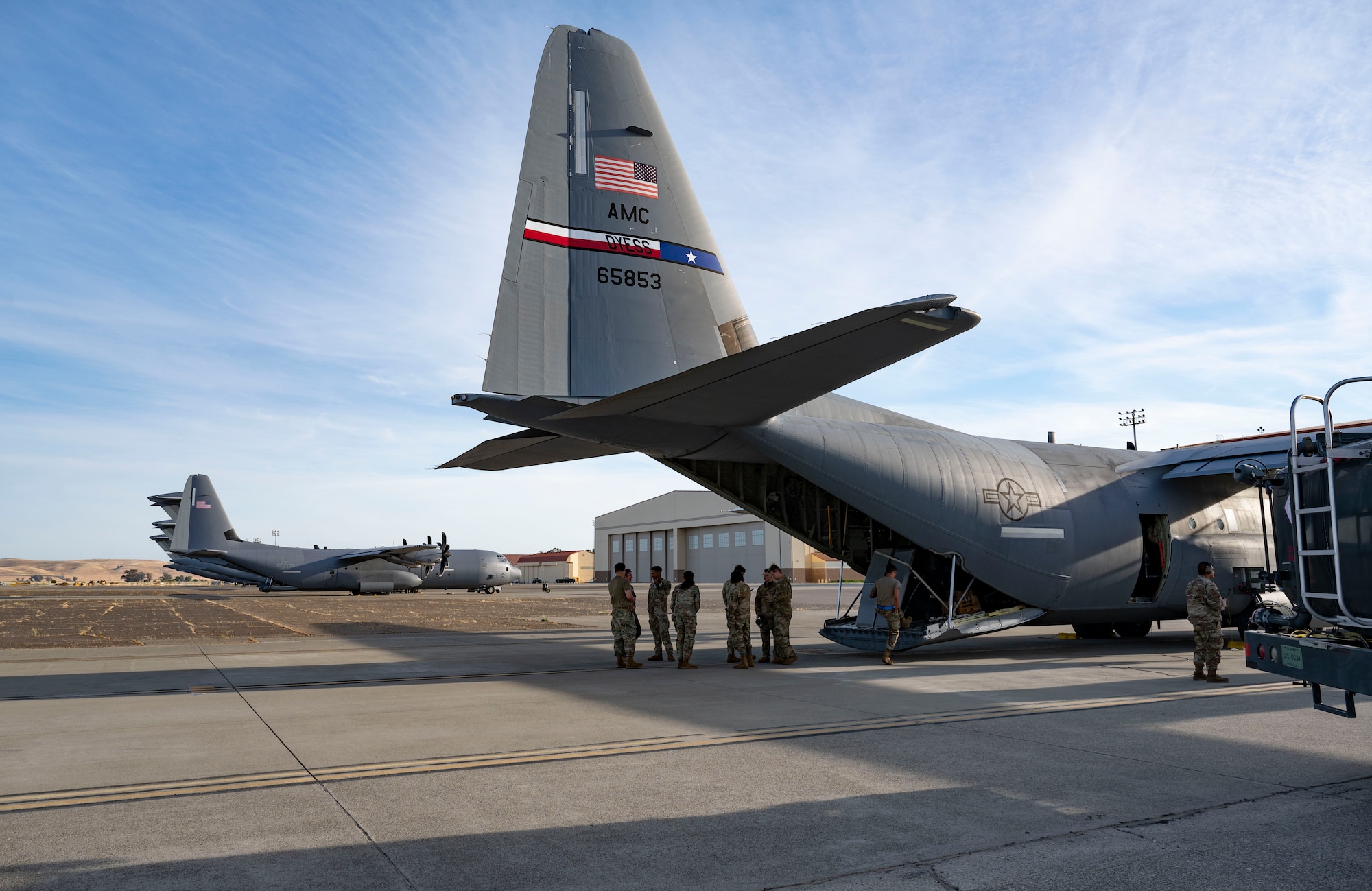 A C-130J Super Hercules assigned to Dyess Air Force Base, Texas, gets refueled at Travis Air Force Base, California, during an extended Maximum Endurance Operation, June 4, 2024. Two aircraft equipped with external fuel tanks completed the MEO to Guam in support of Valiant Shield 2024. Exercises such as Valiant Shield allow the Indo-Pacific Command Joint Forces the opportunity to integrate forces from all branches of service and with our allies to conduct precise, lethal, and overwhelming multi-axis, multi-domain effects that demonstrate the strength and versatility of the Joint Force and our commitment to a free and open Indo-Pacific.. (U.S. Air Force photo by Airman 1st Class Emma Anderson)