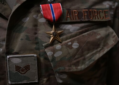 A Bronze Star Medal is awarded to a Staff Sgt. noncommissioned officer in charge assigned to the 48th Rescue Squadron in the base theater at Davis-Monthan Air Force Base, Ariz., June 7, 2024.  The Bronze Stars was awarded for heroic service during Operation Allies Refuge from August 15 to August 29, 2021, at the Hamid Karzai International Airport in Kabul, Afghanistan. (U.S. Air Force photo by Staff Sgt. Abbey Rieves)