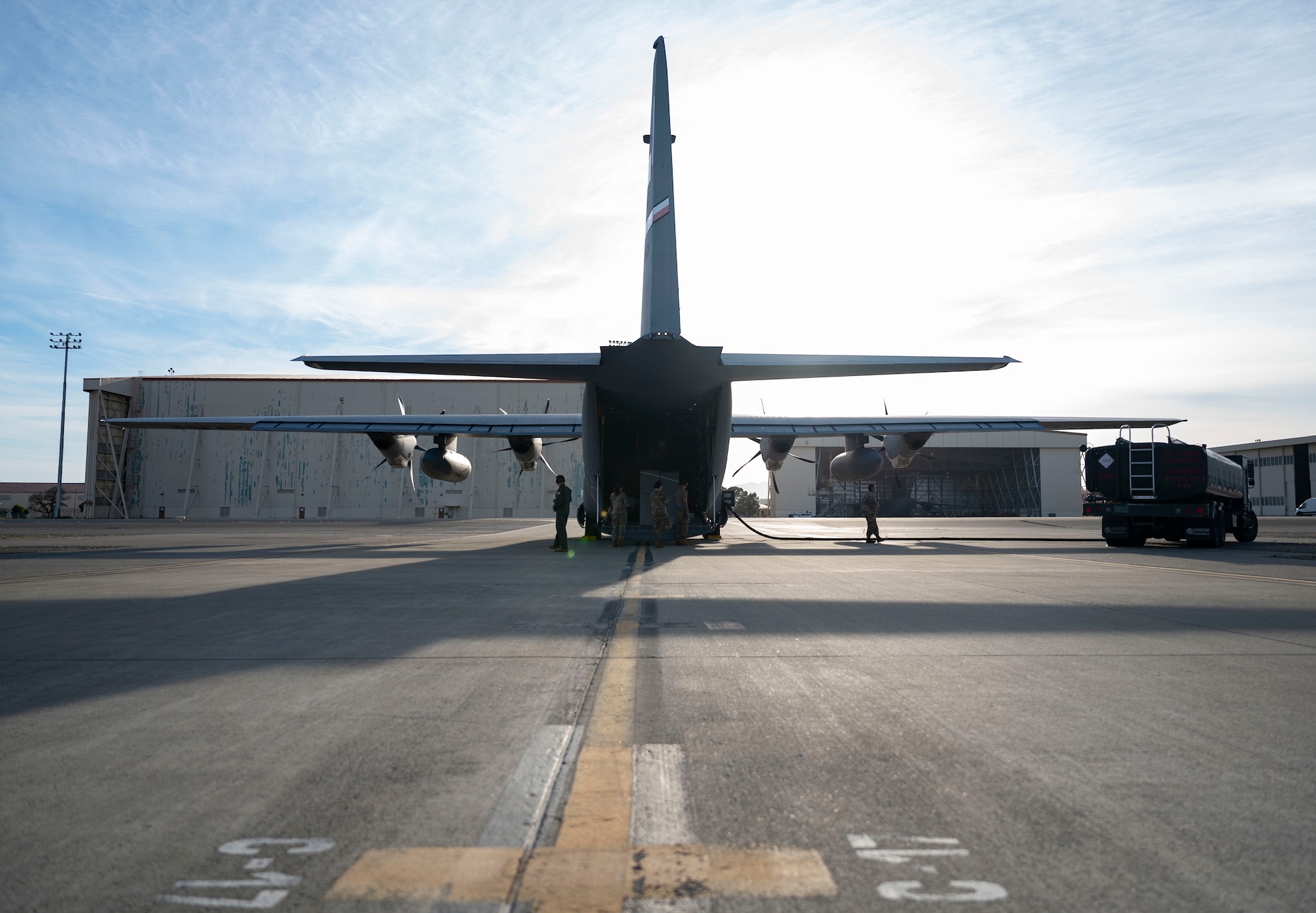 A C-130J Super Hercules assigned to Dyess Air Force Base, Texas, gets refueled at Travis Air Force Base, California, during an extended Maximum Endurance Operation, June 4, 2024. Two aircraft equipped with external fuel tanks completed the MEO to Guam after completing two fuel stops, showcasing the Mobility Air Forces’ ability to “Explode into Theater.” (U.S. Air Force photo by Airman 1st Class Emma Anderson)