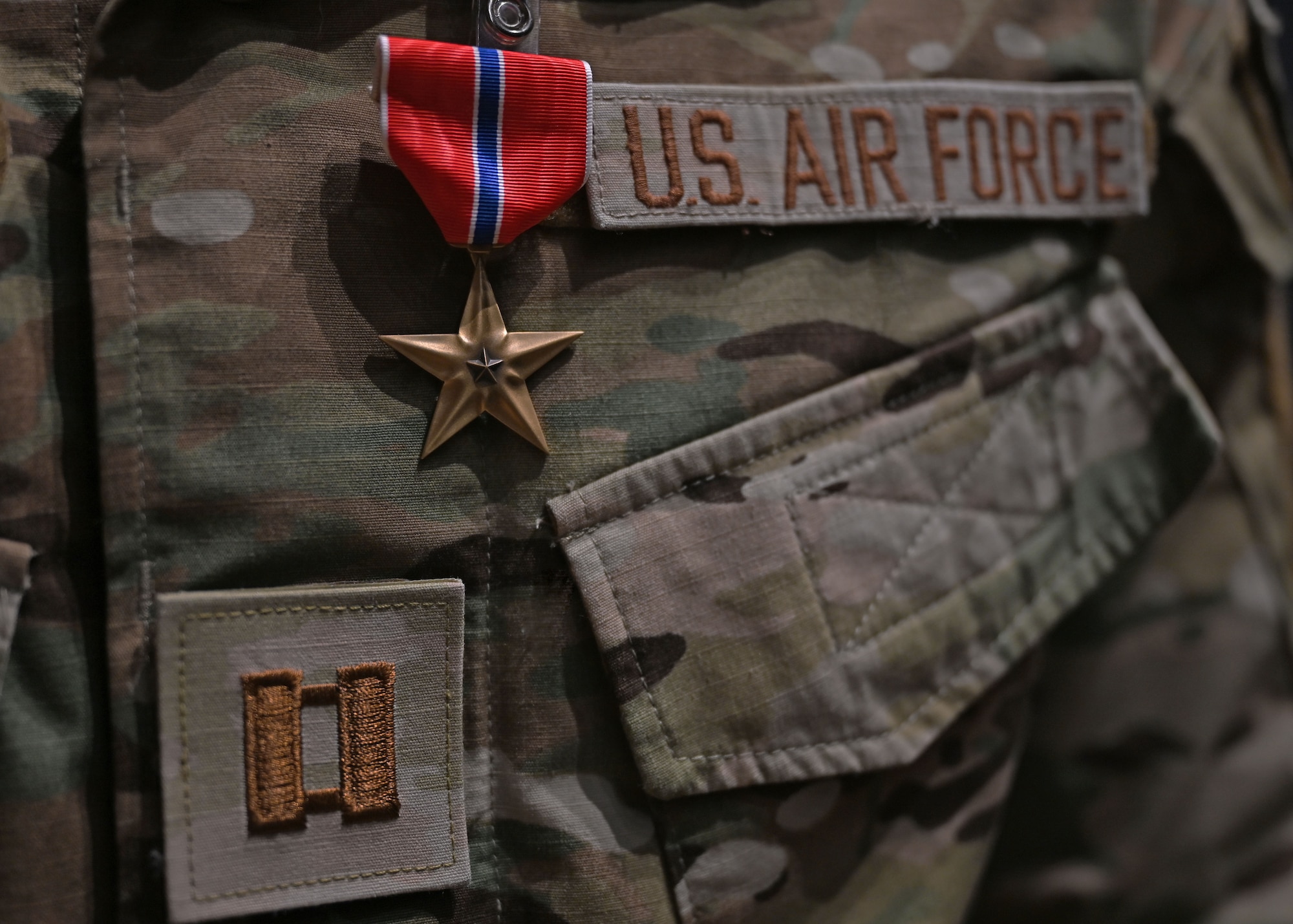 A Bronze Star Medal is awarded to a Captain combat rescue officer assigned to the 48th Rescue Squadron in the base theater at Davis-Monthan Air Force Base, Ariz., June 7, 2024.  The Bronze Star was awarded for heroic service during Operation Allies Refuge from August 15 to August 29, 2021, at the Hamid Karzai International Airport in Kabul, Afghanistan. (U.S. Air Force photo by Staff Sgt. Abbey Rieves)