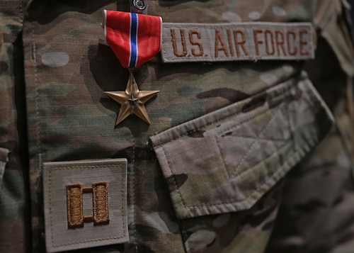 A Bronze Star Medal is awarded to a Captain combat rescue officer assigned to the 48th Rescue Squadron in the base theater at Davis-Monthan Air Force Base, Ariz., June 7, 2024.  The Bronze Star was awarded for heroic service during Operation Allies Refuge from August 15 to August 29, 2021, at the Hamid Karzai International Airport in Kabul, Afghanistan. (U.S. Air Force photo by Staff Sgt. Abbey Rieves)
