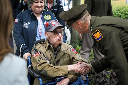 Army Gen. Daniel Hokanson meets World War II veteran Joseph “Ben” Miller during the ceremony commemorating the 80th anniversary of Operation Overlord and D-Day at the Normandy American Cemetery, Colleville-sur-Mer, Normandy, France, June 6, 2024.