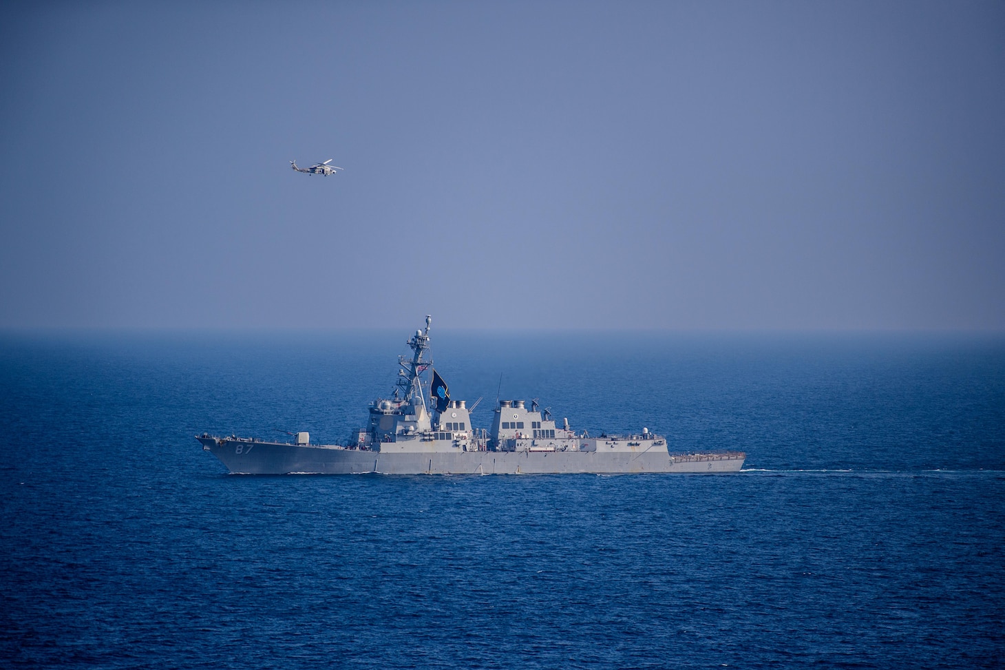 The guided-missile destroyer USS Mason (DDG 87) sails in the Gulf of Aden Nov. 25, 2023. As part of the Dwight D. Eisenhower Carrier Strike Group (IKECSG), the Mason is deployed to the U.S. 5th Fleet area of operations to support maritime security and stability in the Middle East. (U.S. Navy Photo by Mass Communication Specialist 3rd Class Samantha Alaman)