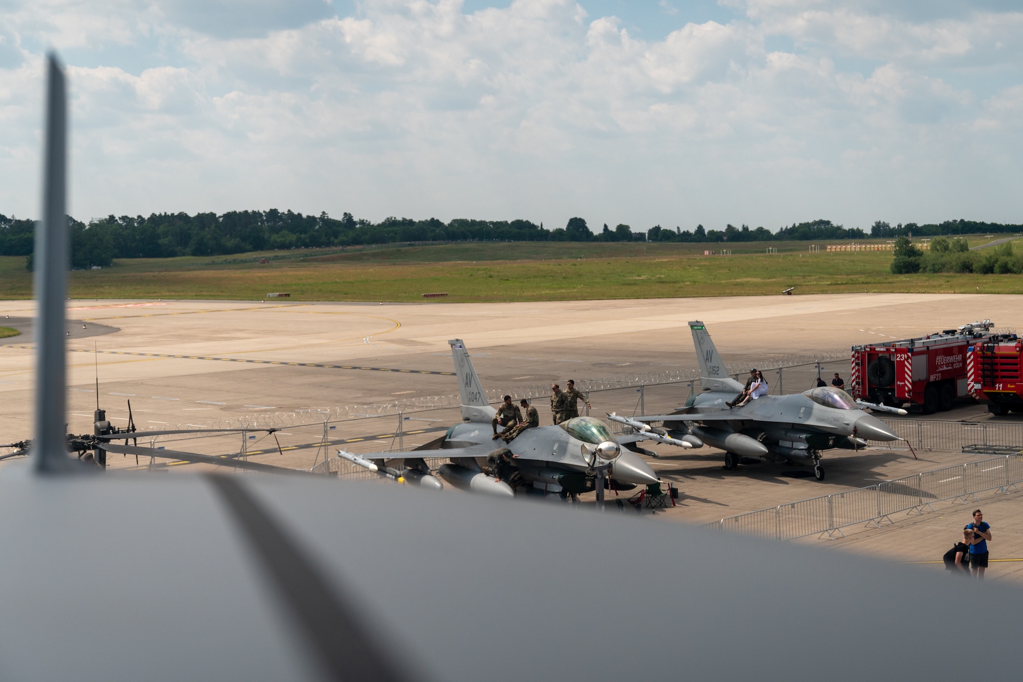 U.S. Air Force F-16 Fighting Falcon aircraft from the 555th Fighter Squadron, Aviano Air Base, Italy, are visible from the top of a U.S. Air Force C-17 Globemaster III cargo aircraft as a static display at the ILA Berlin 2024 Air Show in Berlin, Germany, June 8, 2024. Multiple U.S. aircraft helped to display U.S. air assets and capabilities to airshow attendees as part of the U.S. commitment to international partners. (U.S. Air Force photo by Tech. Sgt. Della Creech)