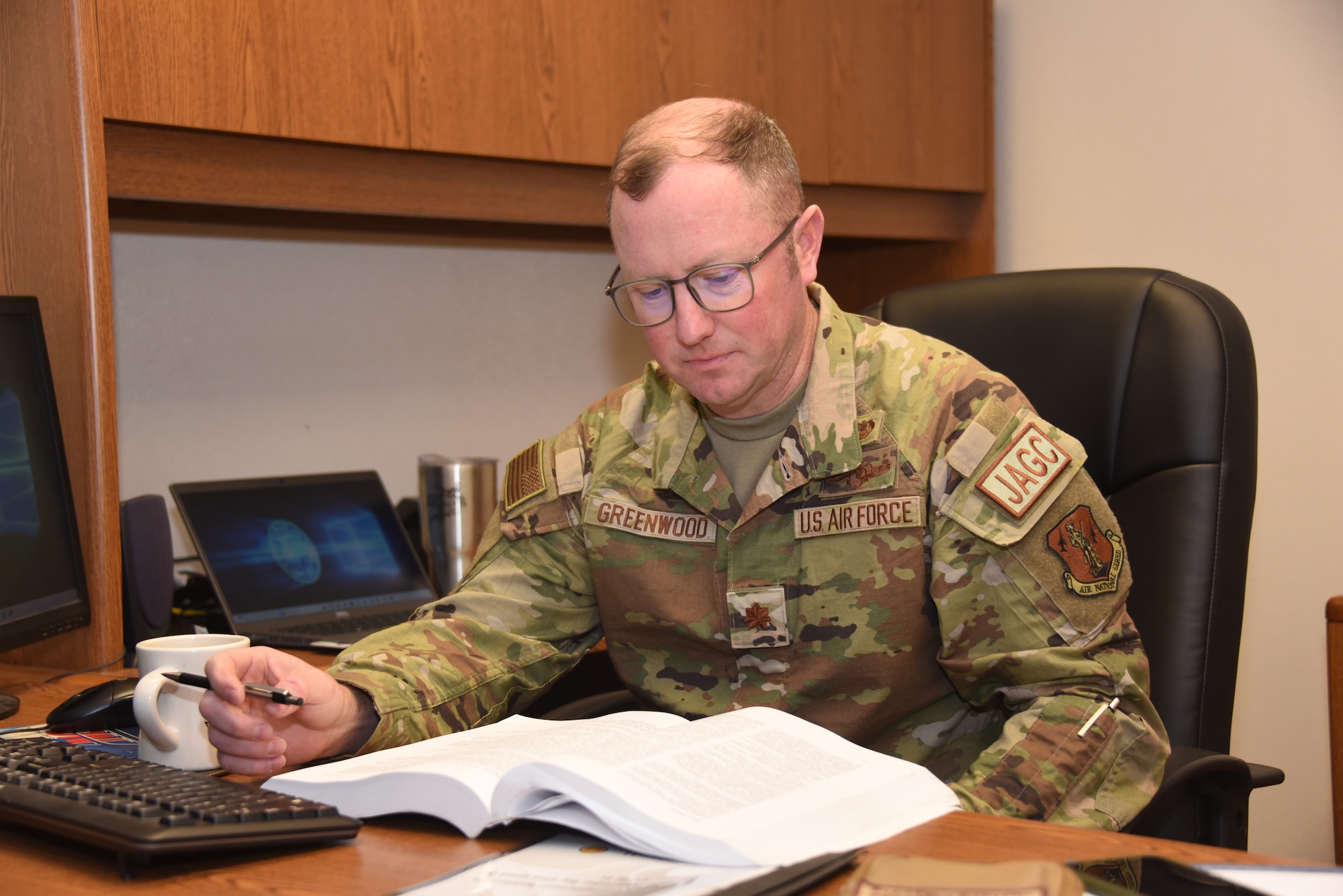 Maj. Patrick Greenwood works in JAG office.