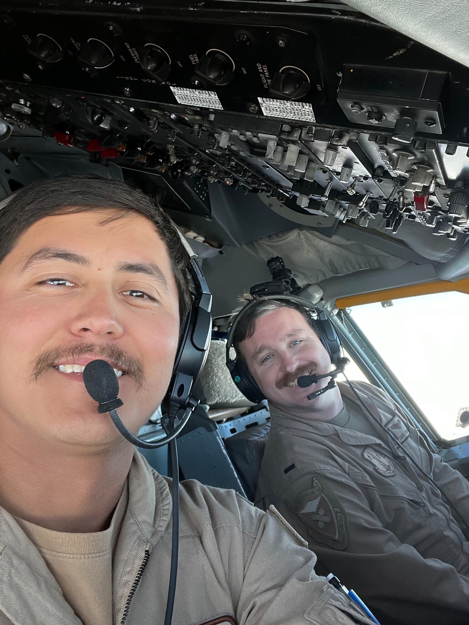 U.S. Air Force Capt. Charles “Chuck” O’Rourke (right), a KC-135R Stratotanker pilot with the 117th Operations Group, poses for a photo with another person at an Undisclosed Location. Photo provided to the 117th Air Refueling Wing Public Affairs Office on May 17, 2024, for the Wing's monthly TEAM TALK newsletter. (U.S. Air National Guard Courtesy Photo)