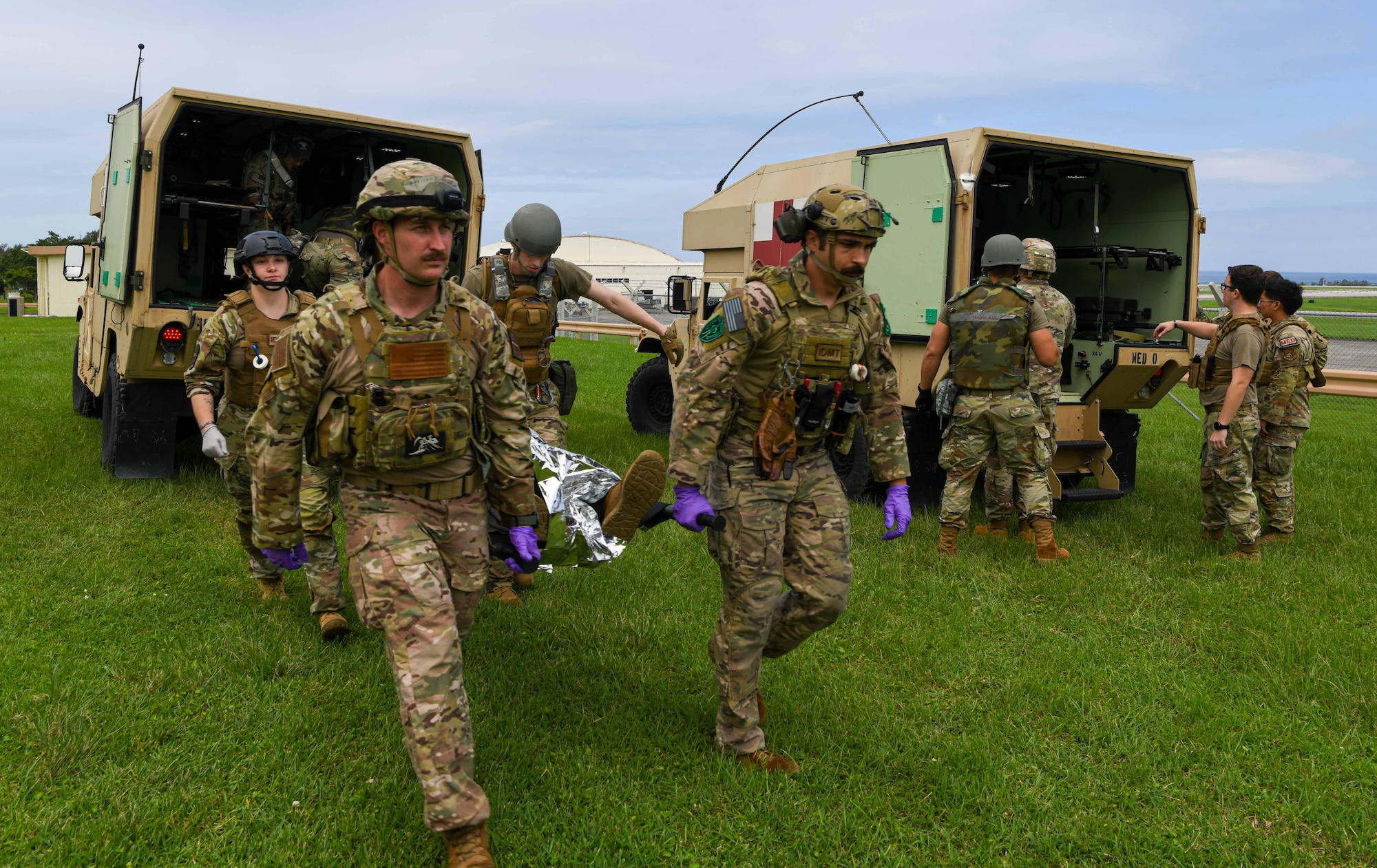 U.S. Service Members transport a patient in a mass casualty exercise.