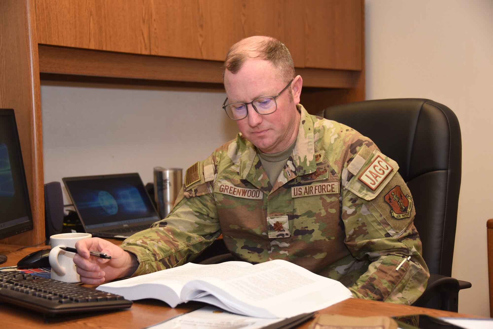 Maj. Patrick Greenwood works in JAG office.