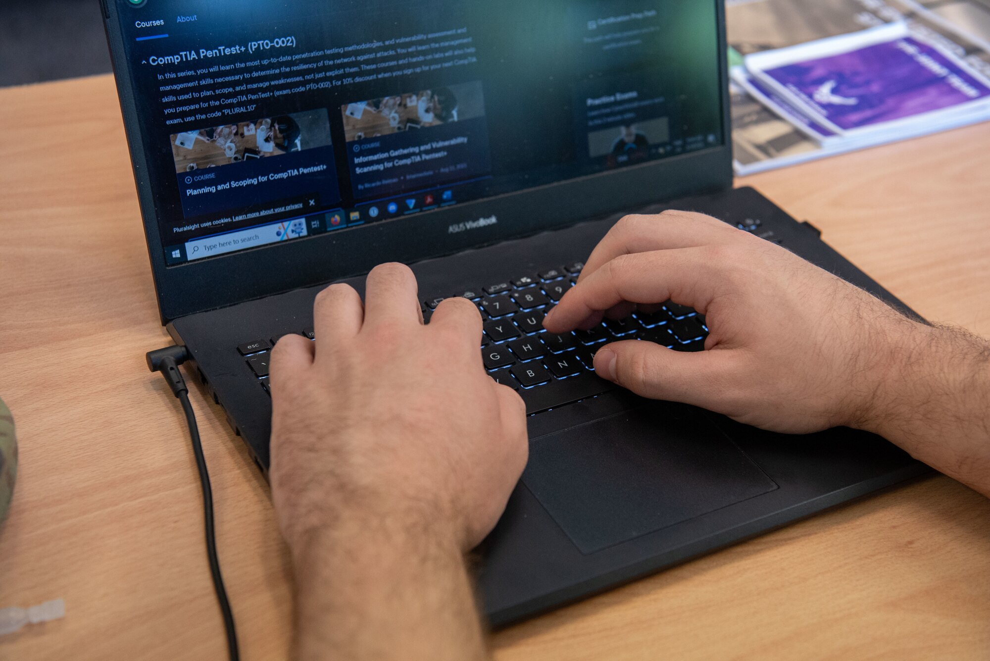Person typing on laptop