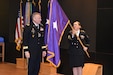 Chaplain (Brig. Gen.) Charles M. Causey, the U.S. Army Deputy Chief of Chaplains, Reserves and USA-IRL Director unfurls his one-star flag moments after being promoted during a ceremony held May 31 in the USA-IRL Zimmerman Auditorium.