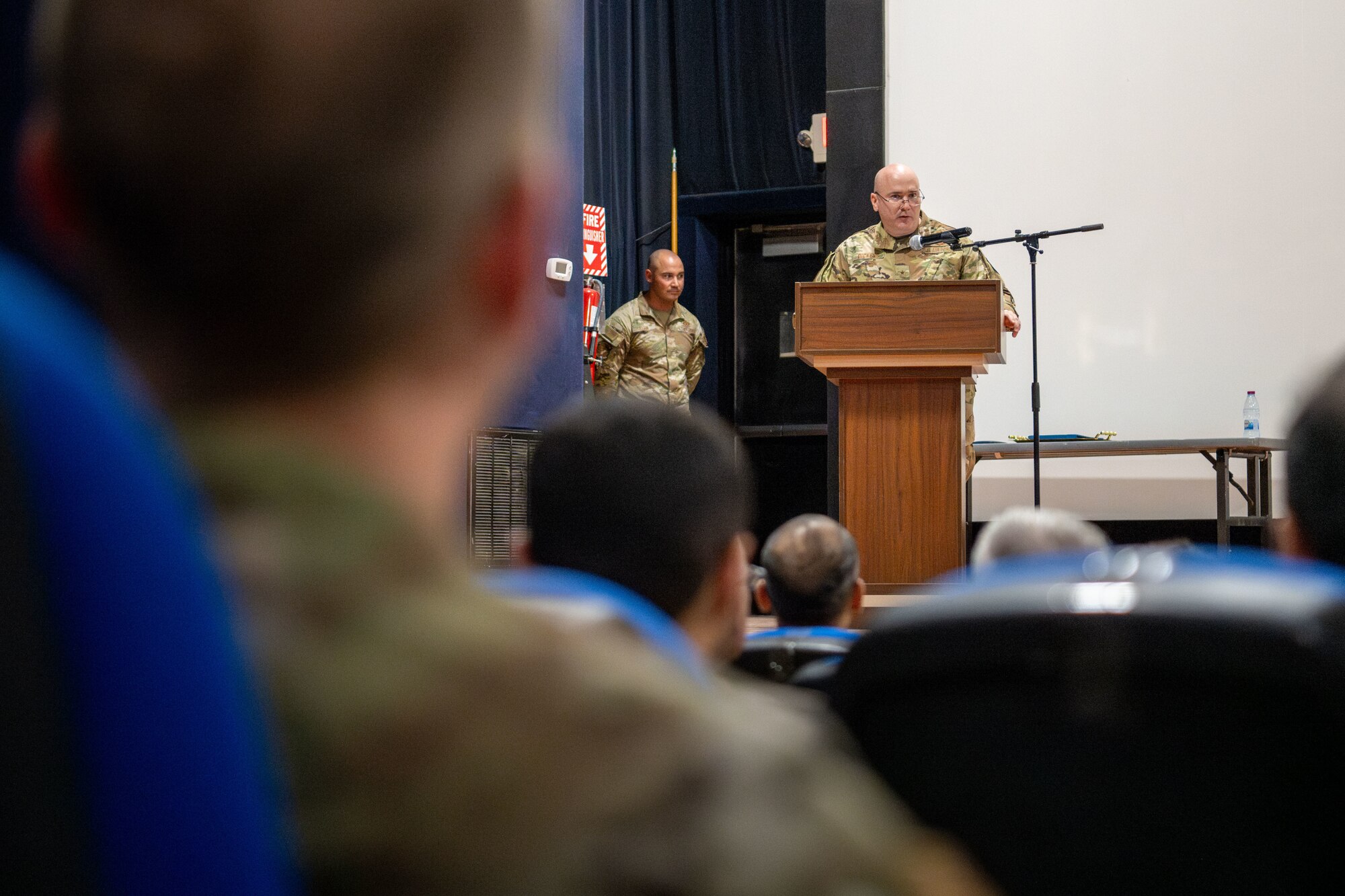 U.S. Air Force Brig. Gen. Richard Dickens, 379th Air Expeditionary Wing commander, delivers remarks during the wing’s change of command ceremony, June 10, 2024. Dickens outlined his goals for Airmen across the wing are to continue to “work hard, work smart and work together.” (U.S. Air Force photo)