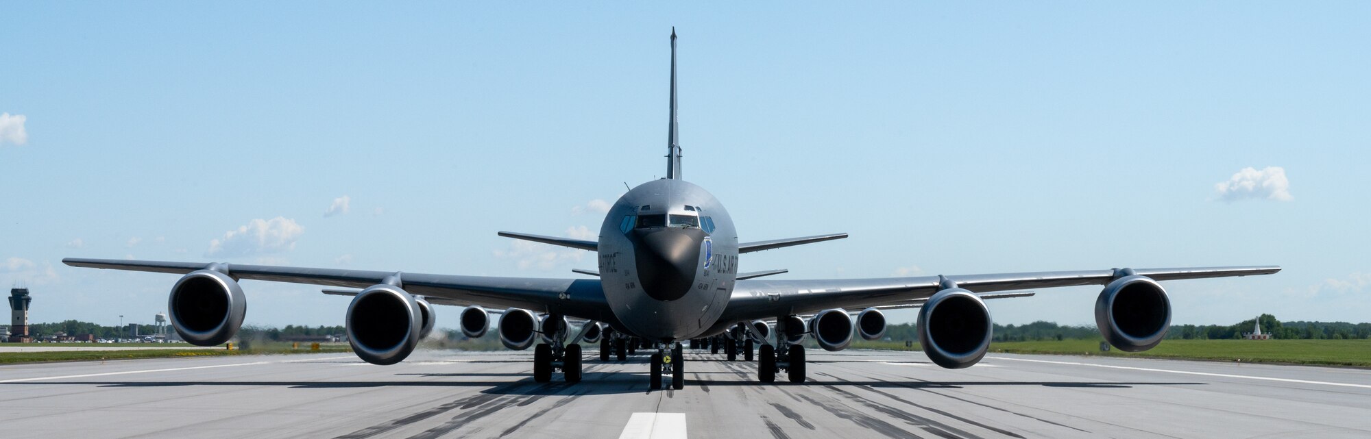The front-view of a KC-135R Stratotanker formation. Eight aircraft are visible in a single-file line.