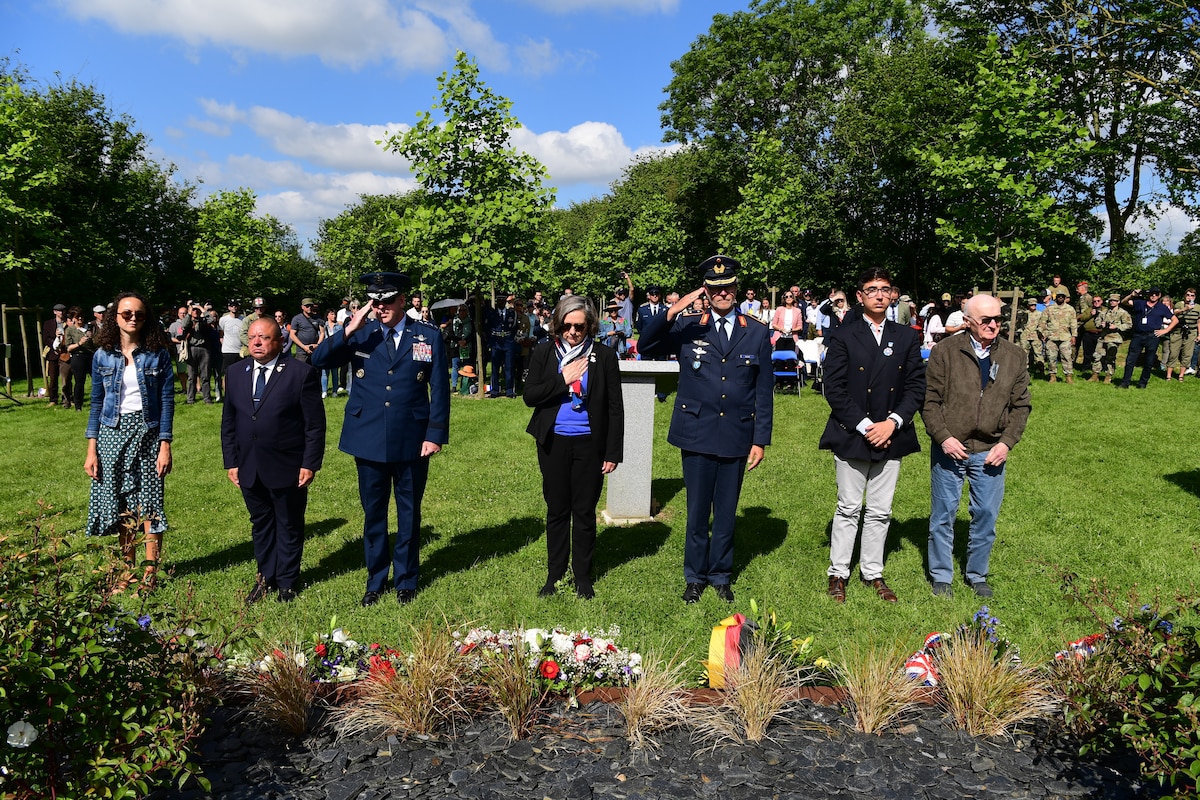 Gen. James B. Hecker, commander of U.S. Air Forces in Europe - Air Forces Africa, salutes after laying a wreath during a C-47 Memorial Garden Ceremony in Picauville, France, June 7, 2024. The memorial garden is decorated with 20 tulip trees and an outline of a C-47 to honor the lives of the service members lost 80 years ago. (U.S. Air Force photo by Senior Airman Noah Sudolcan)