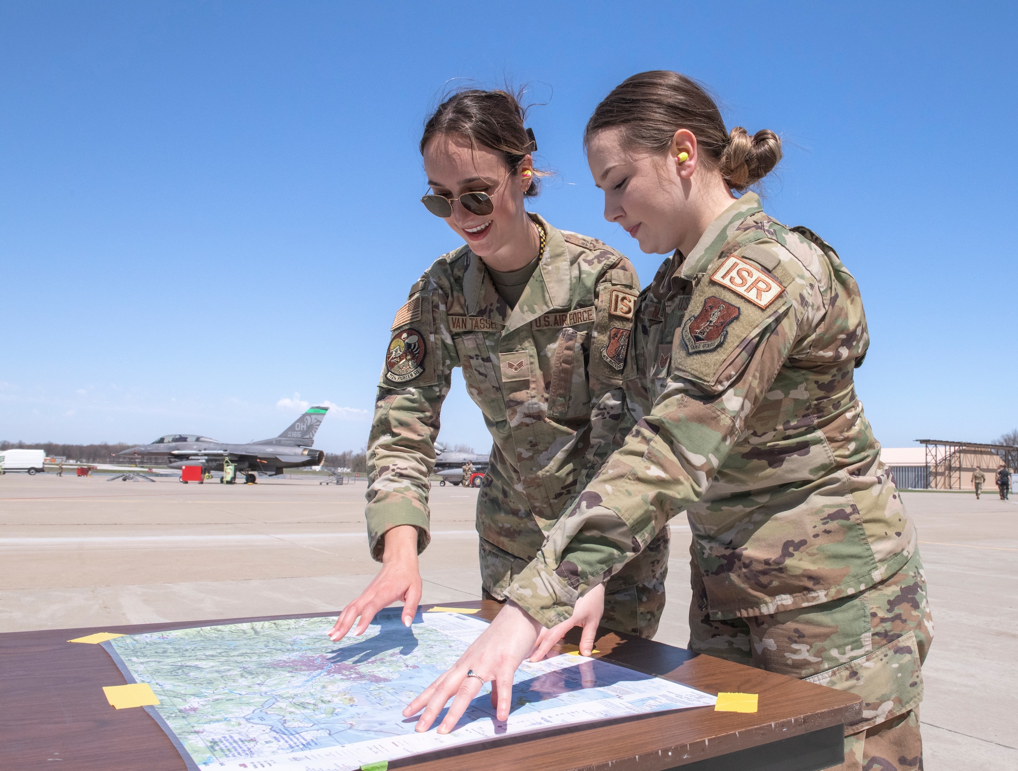 Two women discuss strategy.