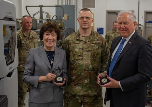 U.S. Senator Susan Collins and Secretary of the Air Force Frank Kendall hold model KC-135's created by Tech. Sgt. Christopher Look, metals technology machinist, and members of the 101st Maintenance Squadron, at the 101st Air Refueling Wing, Bangor, Maine, June 7, 2024.