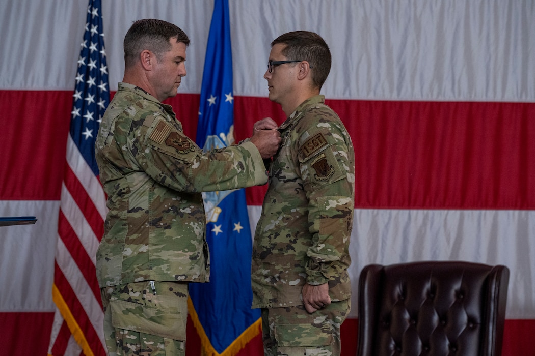 U.S. Air Force Col. Paul Sheets, left, 23rd Wing commander, awards Master Sgt. Peter Pease, 23rd Fighter Group first sergeant, a Bronze Star at Moody Air Force Base, Georgia, May 23, 2024. Pease was awarded a Bronze Star for his outstanding leadership and meritorious service during military operations. (U.S. Air Force photo by Senior Airman Deanna Muir)