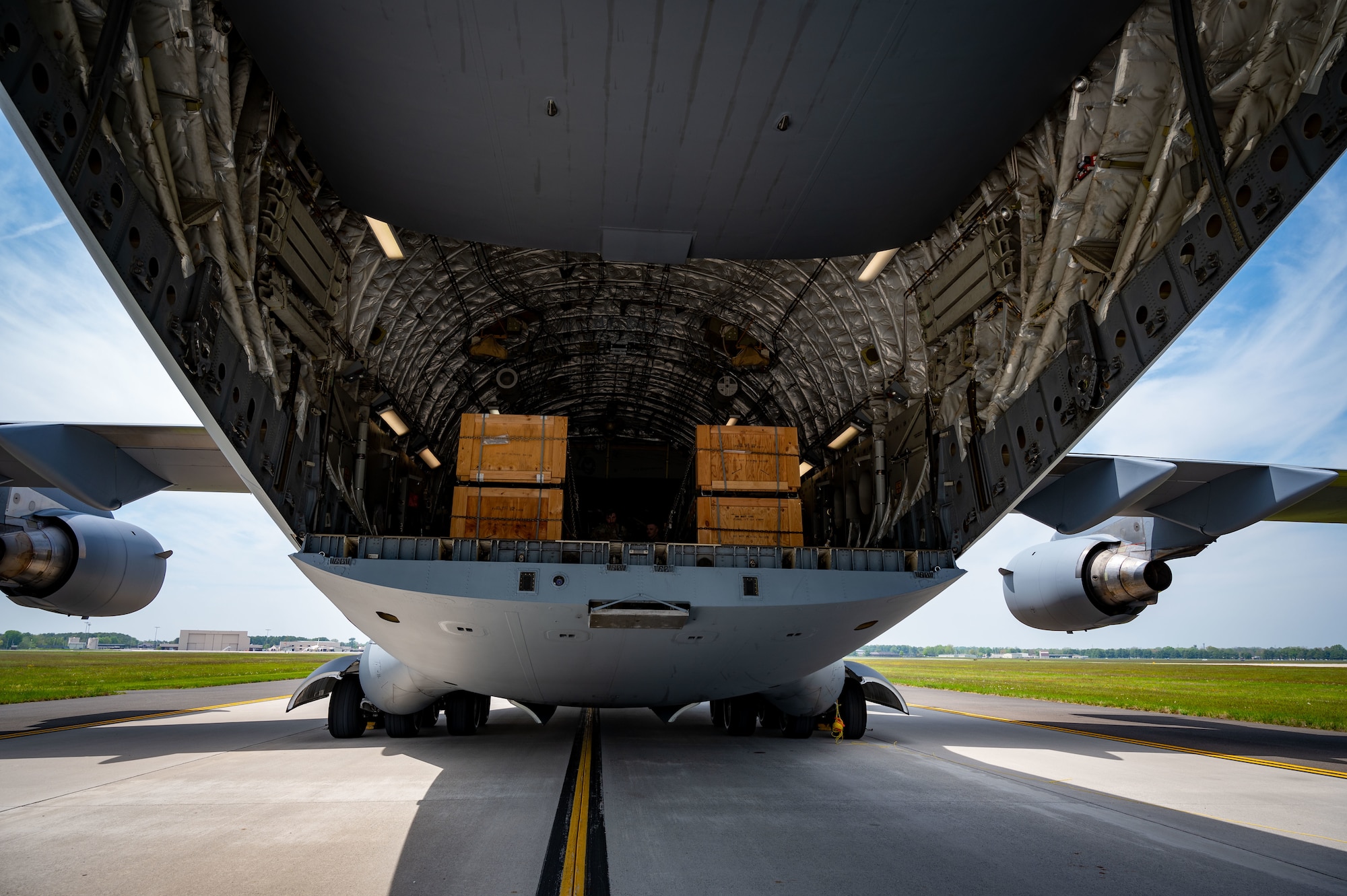 A C-17 Globemaster III assigned to the Air Mobility Command, prepares to receive the upload of munitions at Joint Base McGuire-Dix-Lakehurst, N.J. The munitions cargo is part of an additional security assistance package for Ukraine. The security assistance the U.S. is providing to Ukraine is enabling critical success on the battlefield against the Russian invading force. (U.S. Air Force photo by 2nd Lt. Alexis Kula)